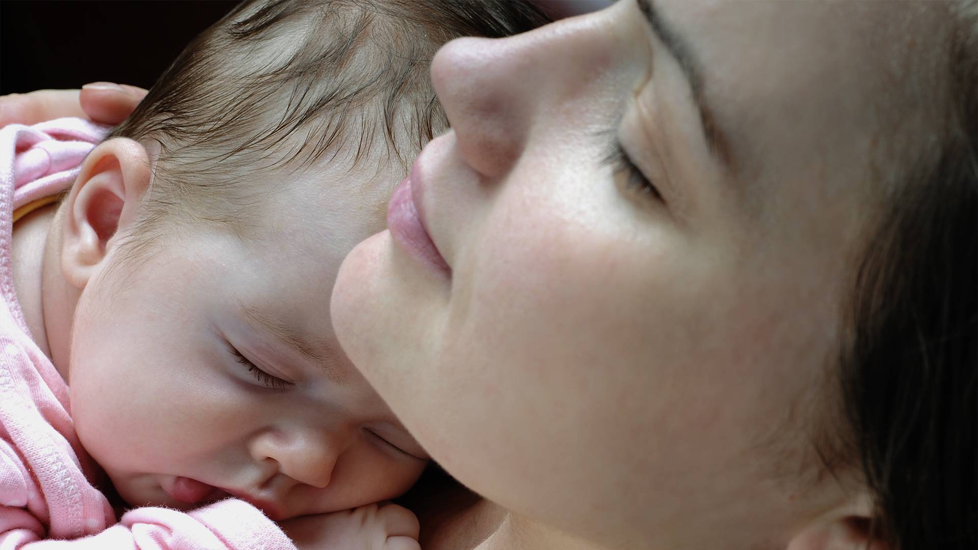 Mother holding her infant